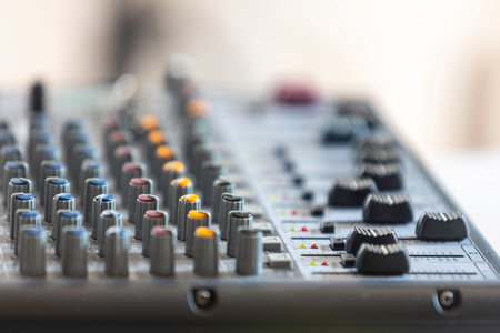 Close-up of the sound mixer used in the recording room with selective focus.の写真素材