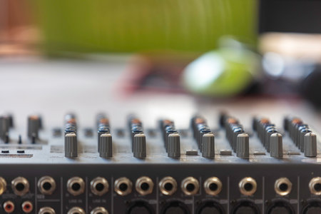 Close-up of the sound mixer used in the recording room with selective focus.の写真素材