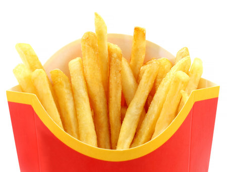 Bright macro french fries on a white background