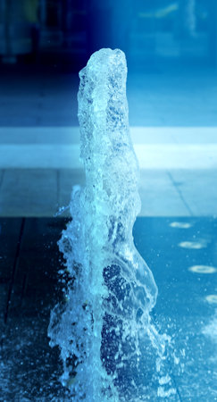 Bright photo transparent pure fountain in the parkの写真素材