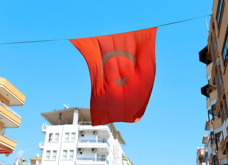 Photo Turkish flag against a blue skyの写真素材