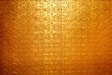 Photo bright golden ornamental wall backgroundの写真素材