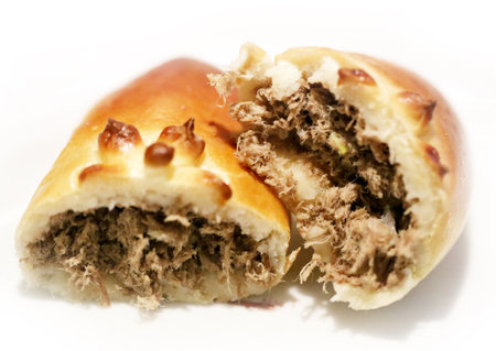 Photo of a macro of delicious patty with meat on a white backgroundの写真素材