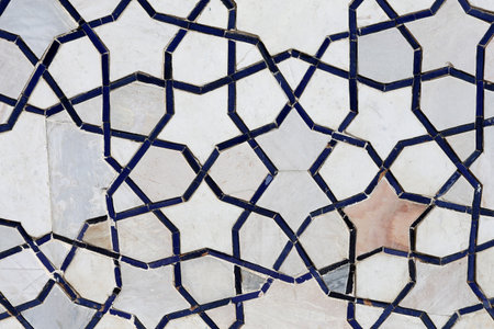 Photo background of gorgeous macro Uzbek oriental ornament on the wall