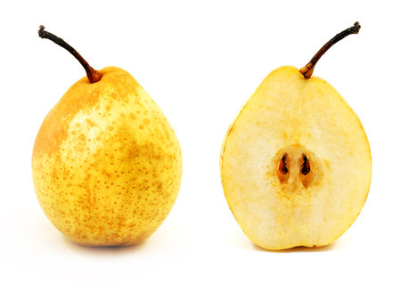 Photo of a macro of a bright delicious in a cut and an entire pear on a white backgroundの写真素材