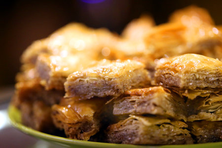 Macro photo of delicious bright Turkish baklava with honey in a restaurant