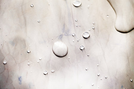 Photo macro background with transparent drops on a retro old bright surface