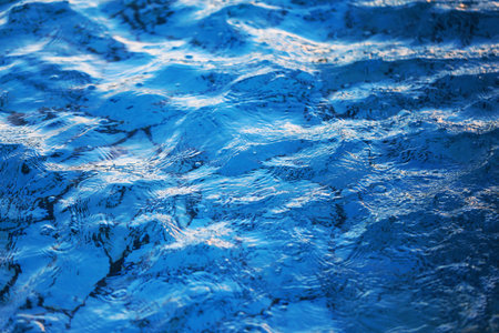 Macro photo background with transparent blue waves of sea water. Example for web background or...