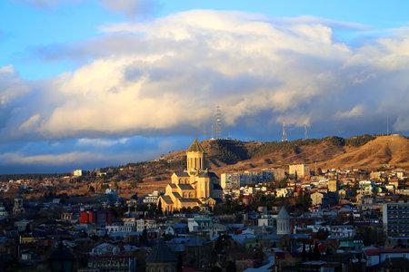 Photo of a beautiful sunset over the city of Tbilisi in Georgia. The view from the top.