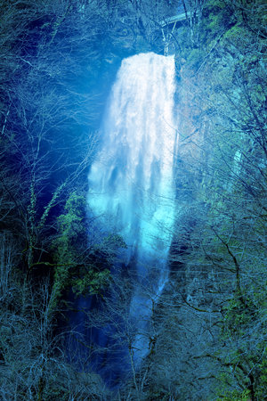 Photo of a huge waterfall in the park in the spring