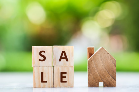 Real estate concept. House with SALE text. Sale, rent, loan, mortgage and investment property.の写真素材