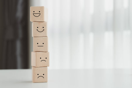 Mental health, Customer service rating experience and feedback emotion and satisfaction survey concept. Wood cube with smile, normal and sad face. Negative, neutral and positive facial expressions.の写真素材