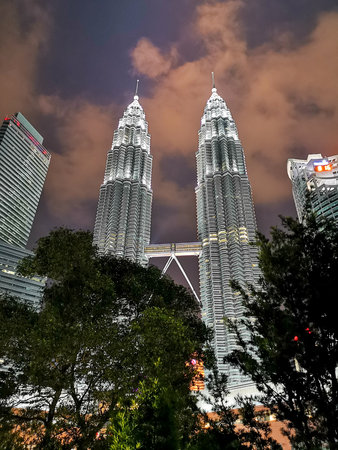 The Petronas Towers viewed from KLCC Park at twilight.のeditorial素材