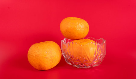 Beautiful tangerines and mint .Fresh tangerines on a pink backgroundの写真素材