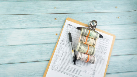 Tax-filling concept  featuring half of U.S IRS 1040 form.の写真素材