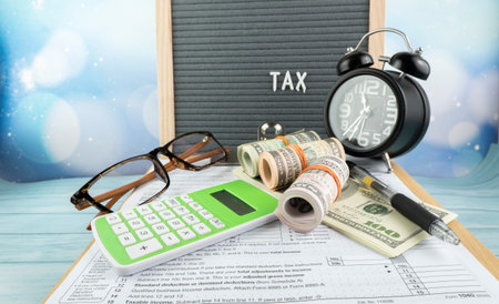 Tax-filling concept  featuring half of U.S IRS 1040 form.の写真素材