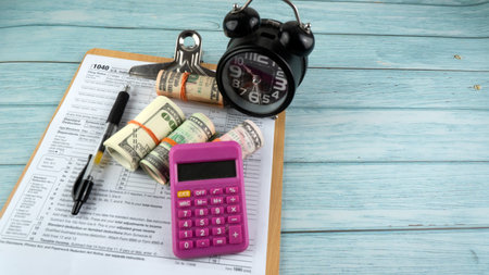 Tax-filling concept  featuring half of U.S IRS 1040 form.の写真素材