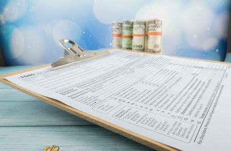 Tax-filling concept  featuring half of U.S IRS 1040 form.の写真素材