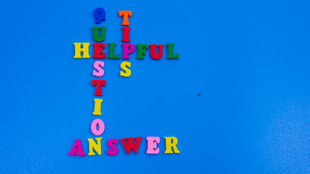 Selective focus of a word that contain hepful, question, tips, answer with an isolated blue backgroundの写真素材