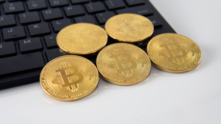 Virtual cryptocurrency concept. Selective focus on bitcoin gold coinの写真素材