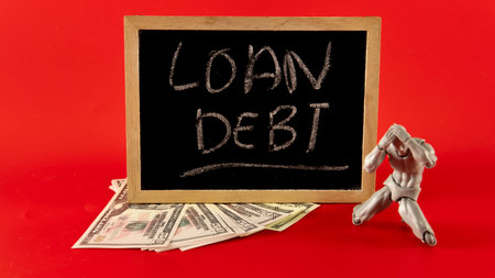 Financial problem concept. Loan Debt Concept. Selective focus on the board hand written loan debtの写真素材