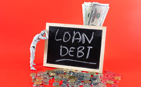 Financial problem concept. Loan Debt Concept. Selective focus on the board hand written loan debtの写真素材