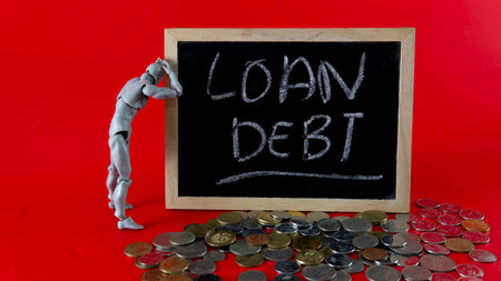 Financial problem concept. Loan Debt Concept. Selective focus on the board hand written loan debtの写真素材
