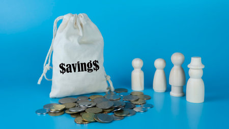 Money saving tips concept. Selective focus on the green board  with a text saving tips. How to save money fro holiday, paying loan or investment conceptの写真素材