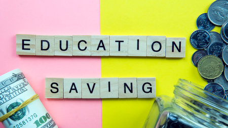 Selectivr focus on a tile of a text Education Saving. Education  nowdays need saving since the cost...