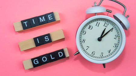 A quote for reminding people how important time is. A self motivation quote regarding time. Selective focus on the clock.の写真素材