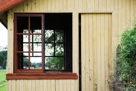 Old wooden house with a window in the village. Old wooden houseの写真素材