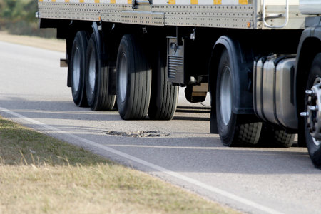 truck on a country road, close-up view of wheels