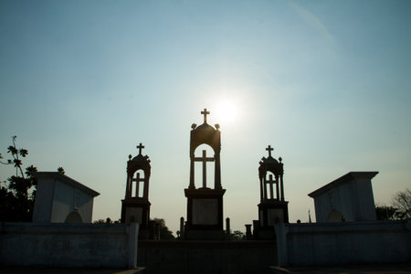 cross silhouette with the sunset as background の写真素材