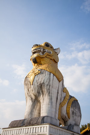 lion statue with blue sky at Surasri Camp, Kanchanaburi, Thailand 