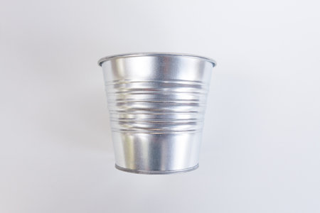 Metallic bucket isolated on white background の写真素材