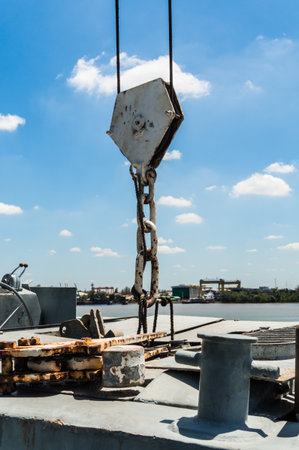 old ship crane holding on boardの写真素材