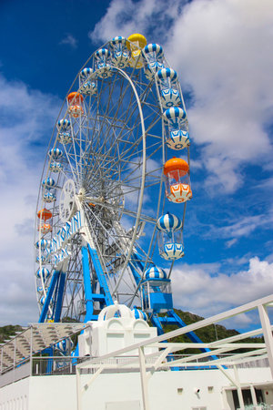 Ferris wheel in blue skyの写真素材
