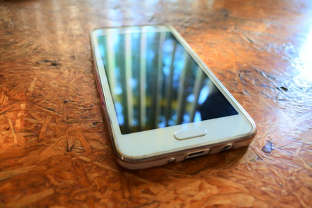 smartphone on the wood table