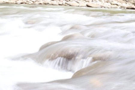 Water flow in rocky riverの写真素材