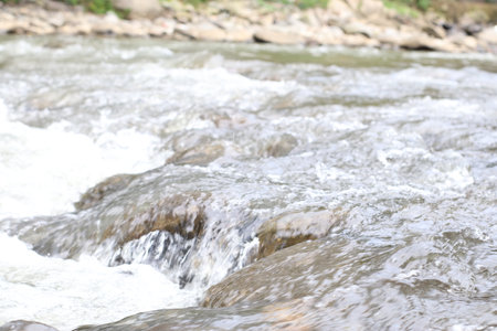 Water flow in rocky riverの写真素材
