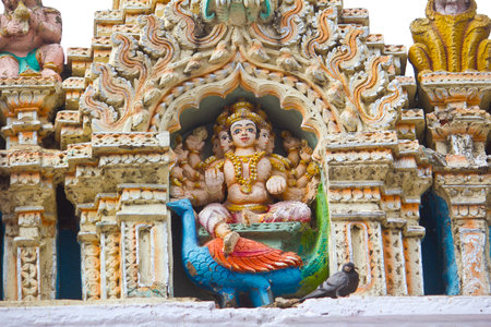 Sculpture of the Hindu God Skanda, or Kartikkeya, or Murugan, son of Shiva, on the wall of the famous ancient Bull temple in Bangaloreのeditorial素材