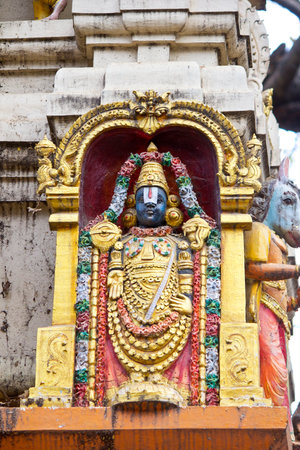 FEBRUARY 25, 2014, BANGALORE, KARNATAKA, INDIA - Sculpture of Balaji or Venkateshwar, form of Vishnu, on the wall of the Hindu templeのeditorial素材