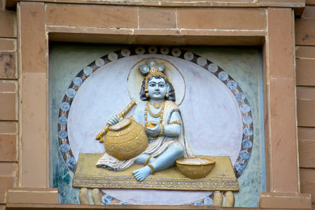 FEBRUARY 27, 2014, VRINDAVAN, UTTAR-PRADESH, INDIA - Image of child Krishna on the temple wallのeditorial素材