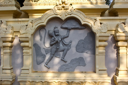 JAN 31, 2015, TIRUPATI, ANDHRA PRADESH, INDIA - Image with the mythological theme (Hanuman with mountain) at the entry to the Tirupati Venkateshwara zoo.のeditorial素材