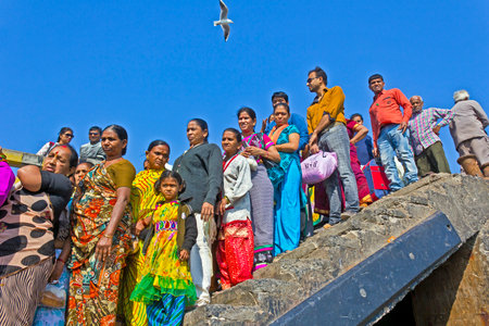 FEB 9, 2015, OKHA, INDIA - Queue of Indian passengers on the pier waits the ferry to drop from Okha port to Bet Dwarka islandのeditorial素材