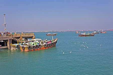 FEB 09, 2015,  BET DWARKA, INDIA - Ferry fith a passengers at the pier of the island Bet Dwarka. This boat goes between Bet Dwarka and Okhaのeditorial素材