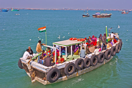 FEB 09, 2015,  BET DWARKA, INDIA - Ferry with a passengers comes to Okhaのeditorial素材