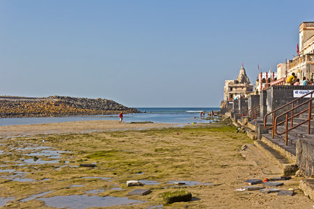 FEB 11, 2015, DWARKA, INDIA - Ghat on the confluence of the sacred river Gomati and Arabian sea on the time of low tideのeditorial素材