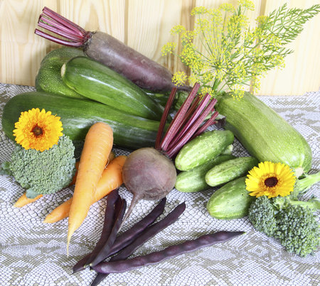 Fresh vegetables against a wooden wall on a grey cloth     の写真素材
