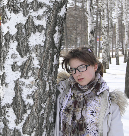 The young girl embraces a birch の写真素材
